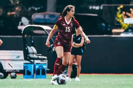 Sam Agresti dribbles the ball up the field.