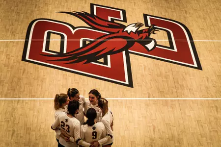 BC Volleyball huddles between points