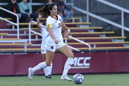 Sam Agresti dribbles the ball up the field against Syracuse.