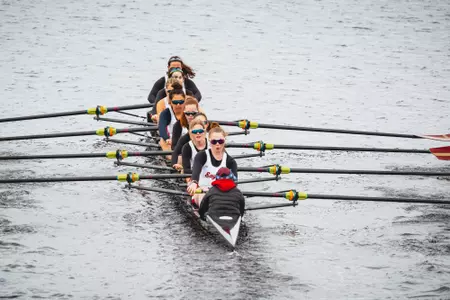 Women's 8+ boat action shot from competition with BU