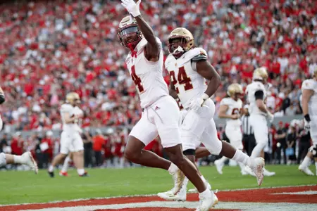 Zay Flowers celebrates a touchdown at NC State.