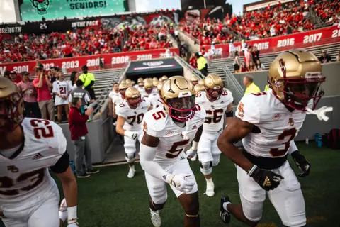 The Eagles rush out of the tunnel at NC State.
