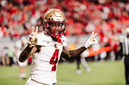Zay Flowers flashes peace signs at NC State.