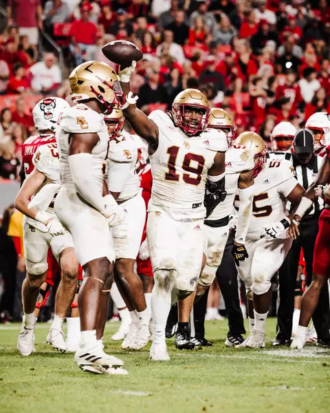 Neto Okpala holds up the ball after recovering a fumble at NC State.