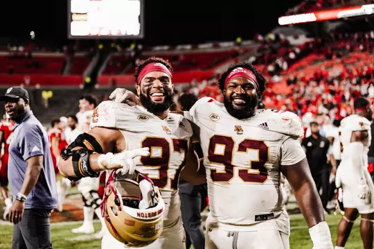 Marcus Valdez and Chibueze Onwuka on the field postgame at NC State.