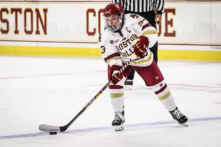 Cayla Barnes looks to move the puck across the blue line.