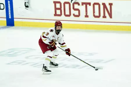 Hannah Bilka skates with the puck through the neutral zone.