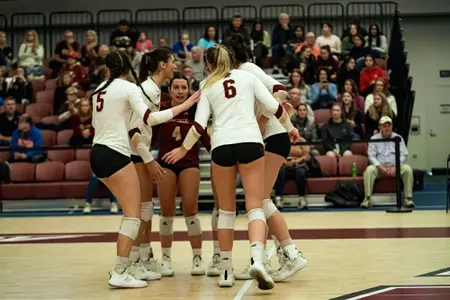BC Volleyball huddles between points in match against Virginia Tech