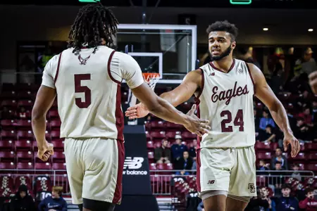 DeMarr Langford Jr. and CJ Penha Jr. high-five