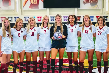 Posed photo of BC women's soccers eight NLI signings for 2022.