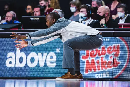 Head coach Earl Grant in a defensive stance