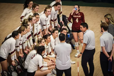 BC Volleyball huddles during match against Virginia
