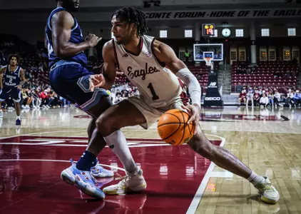 T.J. Bickerstaff sets to score against Rhode Island