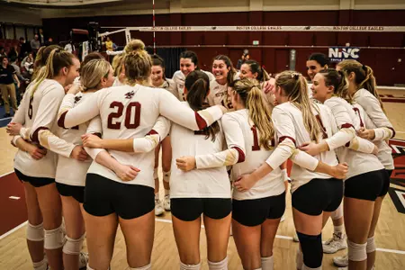 BC Volleyball huddles after win vs Xavier