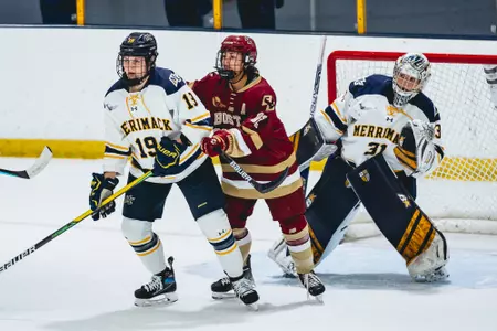Olivia Finocchiaro battles in front of the net at Merrimack.