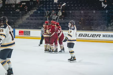 The Eagles celebrate a goal against Merrimack.