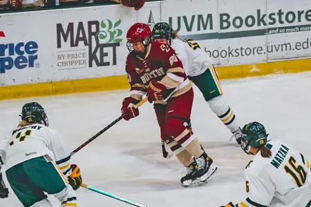 Abby Newhook carries the puck up the ice against Vermont.