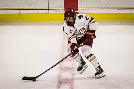 Abby Newhook skates the puck up the ice.