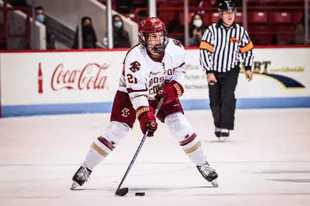 Abby Newhook skates the puck up the ice.