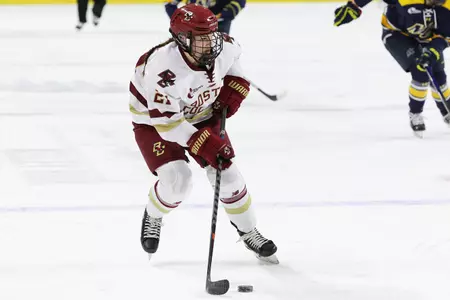 Abby Newhook skates the puck up the ice.