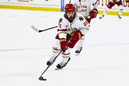 Abby Newhook skates the puck up the ice.