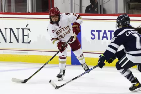 Kiley Erickson dumps the puck in the zone against UNH.