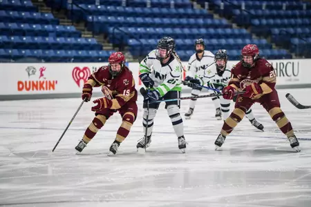 Hannah Bilka (left) and Alexie Guay (right) in action against UNH.