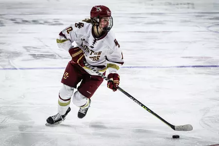 Hannah Bilka carries the puck up the ice.