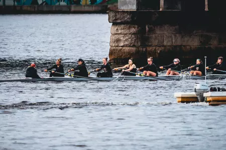 An Eagles eight-boat competes on the Charles River.