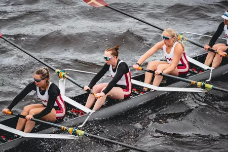 An Eagles eight-boat competes on the Charles River.