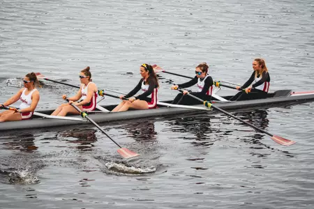 An Eagles' eight-boat rows on the Charles River.