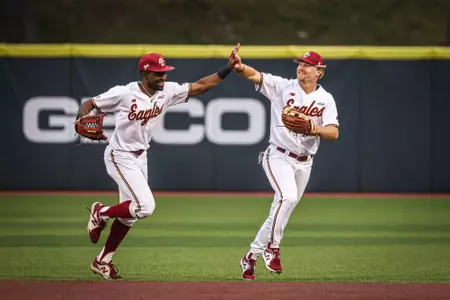 Rafe Chaumette and Barry Walsh high-five vs. Bryant