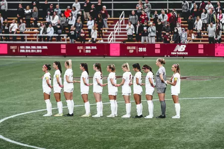 The Eages stand during the national anthem before a soccer game in Newton.
