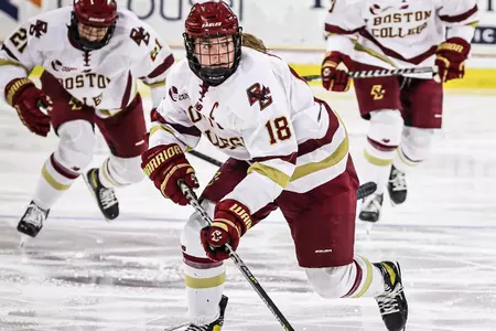 Kelly Browne rushes the puck up the ice.