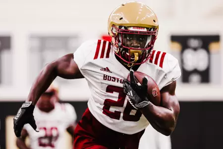 Alec Sinkfield carries the ball at preseason practice No. 11.