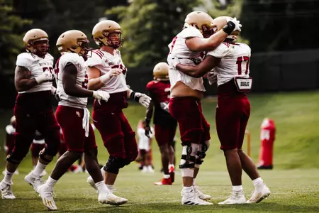 Jeremiah Franklin is congratulated after a touchdown during preseason practice No. 13.