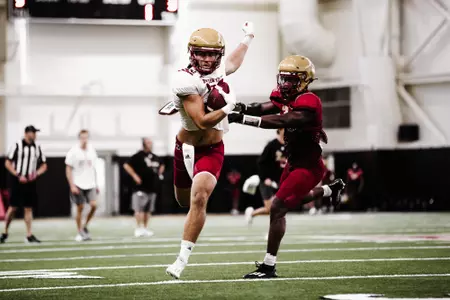 George Takacs runs after a catch during preseason practice No. 16.