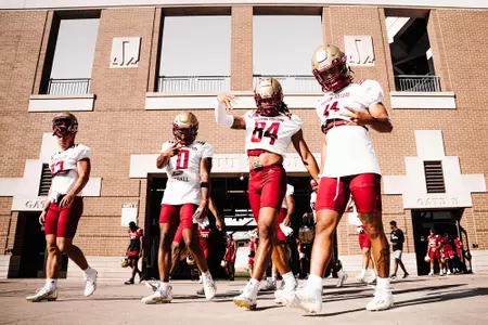 Wide receivers walk out of Alumni Stadium at day two of fall camp.