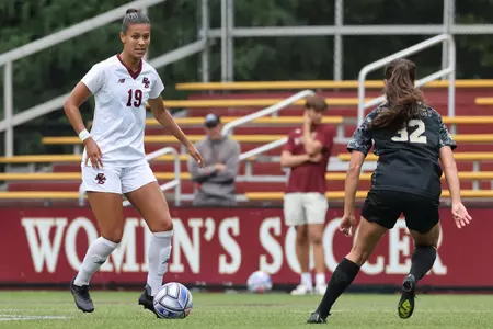 Sydney moore looks to move the ball up the field against Army.