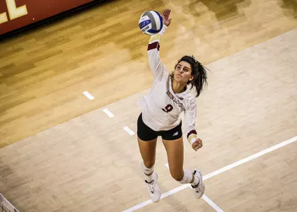 Action shot of Katrina Jensen going up for a spike against Hartford
