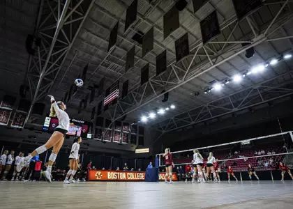 Picture of BC Volleyball going up for a serve against Hartford