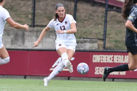 Claire Mensi kicks the ball up field.