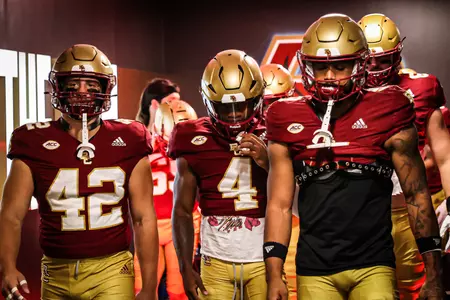 The Eagles walk out of the locker room and down the hall to Alumni Stadium.