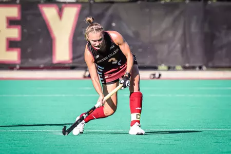 Sarah Johnson lines up a shot in a field hockey game