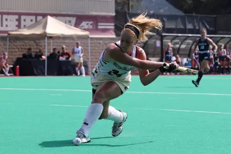 Margo Carlin lining up a shot in a field hockey game vs. Monmouth