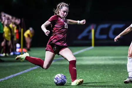 Andi Barth goes to kick the ball against Michigan.