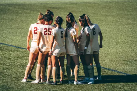 The Eagles huddle up before the first half of play.