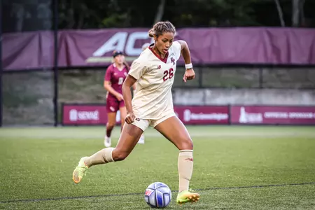 Ava McNeil dribbles the ball up the field.