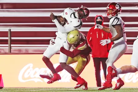 Josh DeBerry tackles Malik Cunningham at Alumni Stadium in 2020.