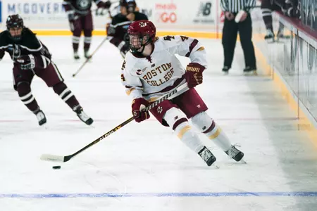 Keri Clougherty skates the puck back towards the blue line.